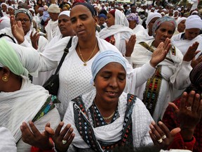 Israeli women from the Ethiopian Jewish community pray during the Sigd holiday marking the desire to "return to Jerusalem," as they celebrate from a hilltop in Jerusalem this week.