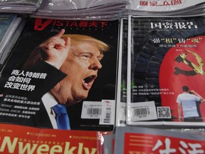 A magazine featuring U.S. President-elect Donald Trump is seen at a bookstore in Beijing on December 12, 2016. The headline reads "How will businessman Trump change the world". Beijing is "seriously concerned" by Trump's suggestion that he could drop Washington's One China policy unless the mainland makes concessions on trade and other issues, it said on December 12.