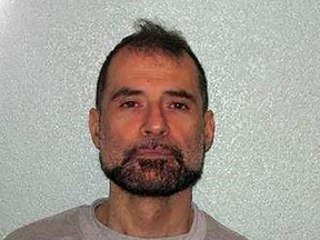 An undated handout picture released by the British Metropolitan Police in London on December 13, shows a custody photograph of Stefano Brizzi, who has been sentenced to life imprisonment for the murder of PC Gordon Semple. Brizzi has today been sentenced to a minimum of 24 years imprisonment for the murder of serving police officer Gordon Semple.  /