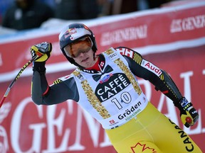 Canada's Erik Guay celebrates in the finish area after arriving third in the Men's Super G FIS Alpine World Cup on December 16, 2016 in Selva di Val Gardena, in the Italian Alps.