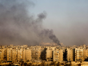 Smoke billows from the former rebel-held district of Bustan al-Qasr in Aleppo, on Dec. 12, 2016, during an operation by Syrian government forces to retake the city.