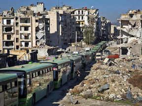 A convoy of buses drives out of the city during the evacuation of rebel fighters and their families from rebel-held neighbourhoods in Aleppo, Dec. 15, 2016.