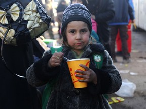 A Syrian girl, who was evacuated from the last rebel-held pockets of Syria's northen city of Aleppo, upon arriving on Dec. 20, 2016 in the opposition-controlled Khan al-Assal region.