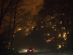Fire erupts on both side of Highway 441 between Gatlinburg and Pigeon Forge, Tenn., Monday, Nov. 28, 2016