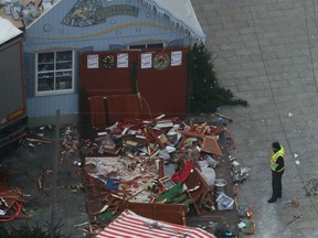 The trailer of a truck stands beside destroyed Christmas market huts in Berlin, Germany, Tuesday, Dec. 20, 2016, the day after a truck ran into a crowded Christmas market and killed several people.