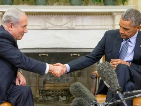 President Barack Obama shakes hands with Israeli Prime Minister Benjamin Netanyahu in the Oval Office of the White House in Washington, Monday, Nov. 9, 2015. The president and prime minister sought to mend their fractured relationship during their meeting, the first time they have talked face to face in more than a year.