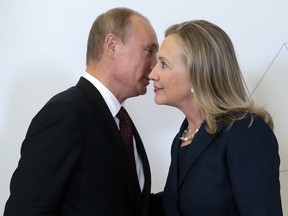 Russian President Vladimir Putin, left, meets U.S. Secretary of State Hillary Rodham Clinton on her arrival at the APEC summit in Vladivostok, Russia, Saturday, Sept. 8, 2012 in a file photo.