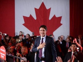 Justin Trudeau is seen on stage at Liberal party headquarters in Montreal early Tuesday, Oct. 20, 2015 after winning the 42nd Canadian general election