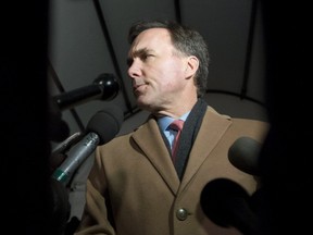 Minister of Finance Bill Morneau speaks to reporters as he arrives for a working dinner with provincial and territorial finance ministers, on Sunday, Dec. 18, 2016.