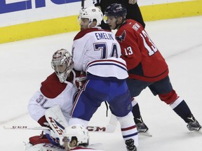 Montreal Canadiens goalie Carey Price and teammate Alexei Emelin defend against the Capitals' Jakub Vrana during the third period of their  game in Washington on Saturday night.