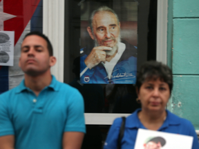 People wait to watch Fidel Castro's ashes pass by on Dec. 1, 2016 in Santa Clara, Cuba.