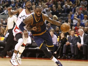 Cleveland Cavaliers' LeBron James blows past Toronto Raptors' defender Terrence Ross during NBA action Monday night in Toronto. James had 34 points as the Cavaliers ended the Raptors' winning streak at six games with a 116-112 victory.