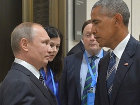 Russian President Vladimir Putin, left, speaks with U.S. President Barack Obama in Hangzhou in eastern China's Zhejiang province, Monday, Sept. 5, 2016.