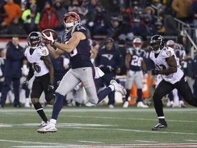 Wide receiver Chris Hogan of the New Engalnd Patriots hauls in a 79-yard touchdown pass from quarterback Tom Brady during Monday night's NFL game in Foxboro, Mass. The Pats won their 11th game of the season against two defeats, beating the Baltimore Ravens 30-23.