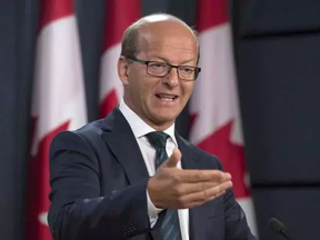 Leader of the Opposition in the Senate, Senator Claude Carignan speaks at a news conference in Ottawa, Oct. 3, 2016.