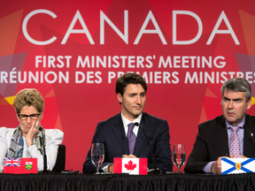 Ontario Premier Kathleen Wynne, Prime Minister Justin Trudeau, and Nova Scotia Premier Stephen McNeil during the closing news conference at the First Ministers Meeting in Ottawa, Friday Dec. 9, 2016.