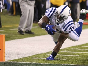 Indianapolis Colts running back Robert Turbin dives in for a touchdown score against the New York Jets during the second half on Monday in East Rutherford, N.J. The Colts routed the Jets 41-10.
