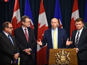 Opposition Leaders, left, Progressive Conservative Ric Mclver, Liberal David Swann, Alberta Party Greg Clark and Wildrose Brian Jean held a joint news conference to present terms of reference that are essential for opposition members to participate in the government-led child intervention panel in Edmonton, Tuesday, Dec. 13, 2016.