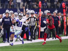 Ezekiel Elliott of the Dallas Cowboys is off and running as he makes his way down the sideline against the Tampa Bay Buccaneers in NFL action Sunday night in Dallas. Elliott had a career-high 159 yards in the Cowboys 26-20 victory.