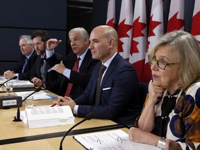 Members of the House of Commons special committee on electoral reform Luc Therault Bloc Quebecois, left to right, Scott Reid Conservative Party, Francis Scarpaleggia Liberal Party, Nathan Cullen NDP, and Elizabeth May Green Party hold a news conference in Ottawa, Thursday, December 1, 2016.