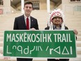 Edmonton Mayor Don Iveson and Enoch Cree Nation Chief Billy Morin pose for a photo following the official announcement of the renaming of 23 Avenue between 215 Street and Anthony Henday to Maskêkosihk Trail