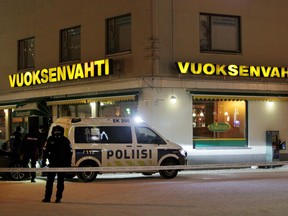 Police guard the area where three women were killed in a shooting incident outside of a restaurant in Imatra, Finland after midnight, Sunday, Dec. 4, 2016. A gunman killed a local town councilor and two journalists, all women, in an apparent random shooting in a nightlife district in a small town in southeastern Finland, police said Sunday.