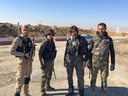Members of a Shia mililia including a shaggy-haired teenager, third from left, who fancied himself an Iraqi Justin Bieber had just returned from the frontlines in Mosul. They celebrated every time coalition warplanes bombed Islamic State fighters in this besieged city.