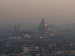 The Invalides dome is seen from the Generali balloon, which measures air quality as Paris suffers a pollution spike, Tuesday, Dec. 6. Paris' Police authority is again cracking down on the city's rocketing air pollution with a seonc day of a traffic-regulating scheme that aims to halve the day's emissions from road vehicles.
