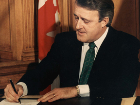 Prime Minister Brian Mulroney signs the Free Trade Agreement between Canada and the United States in 1988.