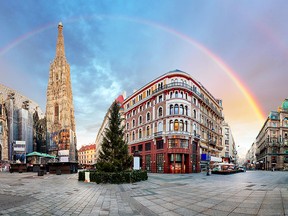 Panoramic view of Stephens Cathedral and Vienna Square with rainbow.