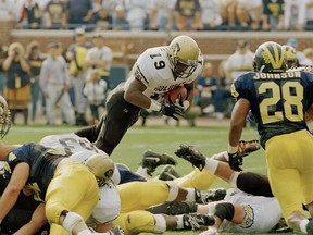 In this Sept. 24, 1994, file photo, Colorado’s Rashaan Salaam (19) dives over the goal line for a one-yard touchdown against Michigan. Salaam, the 1994 Heisman Trophy winner, was found dead in Boulder, Colorado on Dec. 5.