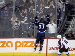 Winnipeg Jets forward Nikolaj Ehlers (left) celebrates his third-period goal against the Colorado Avalanche on Dec. 18.