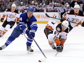Toronto Maple Leafs centre Auston Matthews (left) battles for the puck with Anaheim Ducks centre Rickard Rakell on Dec. 19.