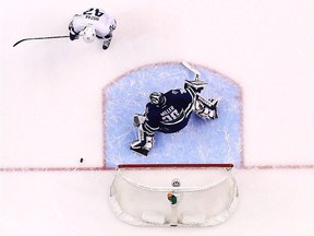 Toronto Maple Leafs forward Tyler Bozak (top) is stopped by Vancouver Canucks goaltender Ryan Miller in shootout action on Dec. 3.