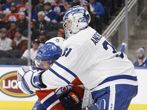 Toronto Maple Leafs goaltender Frederik Andersen (right) clutches Edmonton Oilers forward Jordan Eberle on Nov. 29.