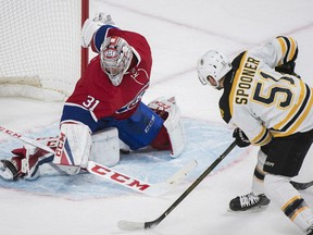 Boston Bruins' Ryan Spooner scores on Montreal Canadiens goaltender Carey Price during overtime in Montreal on Monday.