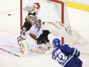 Henrik Sedin of the Canucks scores the game-winning goal in overtime against Anaheim Ducks netminder John Gibson in Vancouver on Friday night.