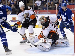 Anaheim Ducks goalie John Gibson makes a save on Toronto Maple Leafs left wing James van Riemsdyk during the second period in Toronto on Monday.