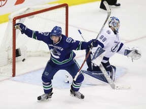Bo Horvat of the Vancouver Canucks celebrates after scoring what proved to be the game-winning goal against Tampa Bay Lightning goaltender Andrei Vasilevskiy during NHL action Friday night in Vancouver. The Canucks recorded a much-needed 4-2 victory.