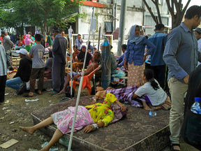 City general hospital patients rest in the open following an earthquake in Pidie Jaya, Aceh province on Dec. 7, 2016.