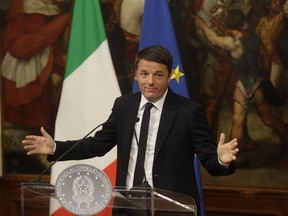 Italian Premier Matteo Renzi speaks during a press conference at the premier's office Chigi Palace, early Monday, Dec. 5, 2016. Renzi acknowledged defeat in a constitutional referendum and announced he would resign on Monday.