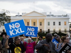 Demonstrators, celebrating U.S. President Barack Obama's blocking of the Keystone XL oil pipeline, rally in front of the White House in Washington, DC on Nov. 6, 2015.