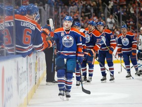Mark Letestu of the Edmonton Oilers gets congratulations from his teammates after soring what proves to be the game-winning goal against the Winnipeg Jets in NHL action Sunday night at Rogers Place in Edmonton. Letestu had two goals in a 3-2 victory.