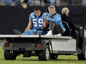 In this Nov. 17, 2016, file photo, Carolina Panthers linebacker Luke Kuechly is taken off the field after being injured in the second half of an NFL football game against the New Orleans Saints, in Charlotte, N.C. Kuechly returned to the practice field, Wednesday, Dec. 7, 2016, for the first time since sustaining a concussion in the team's Nov. 17 game against the Saints.