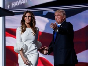 Melania Trump, wife of Republican Presidential Candidate Donald Trump walks to the stage as Donald Trump introduces her during the opening day of the Republican National Convention in Cleveland, Monday, July 18, 2016.