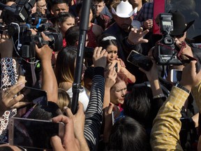 Rubi Ibarra arrives at the site of a Mass that is part of her down-home 15th birthday party