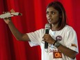 Grace Nathan, of Malaysia, whose mother was on board the missing Malaysian flight MH370, shows how a debris piece looks like during a media conference in Antananarivo, Madagascar, Monday, Dec. 5, 2016.