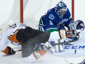 Goaltender Ryan Miller of the Vancouver Canucks stops Chris Wagner of Anaheim Ducks from close in during NHL action Thursday night in Vancouver. The Ducks made it three straight wins with a 3-1 victory.