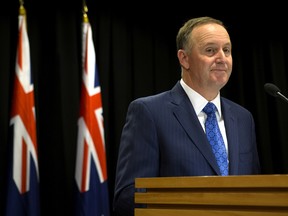 New Zealand Prime Minister John Key announces his decision to resign from politics, in Wellington, New Zealand, Monday, Dec. 5, 2016.