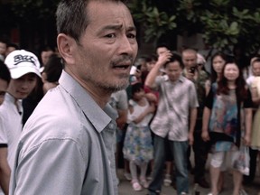 Chen Gang as taxi driver Lao Shi in Old Stone.